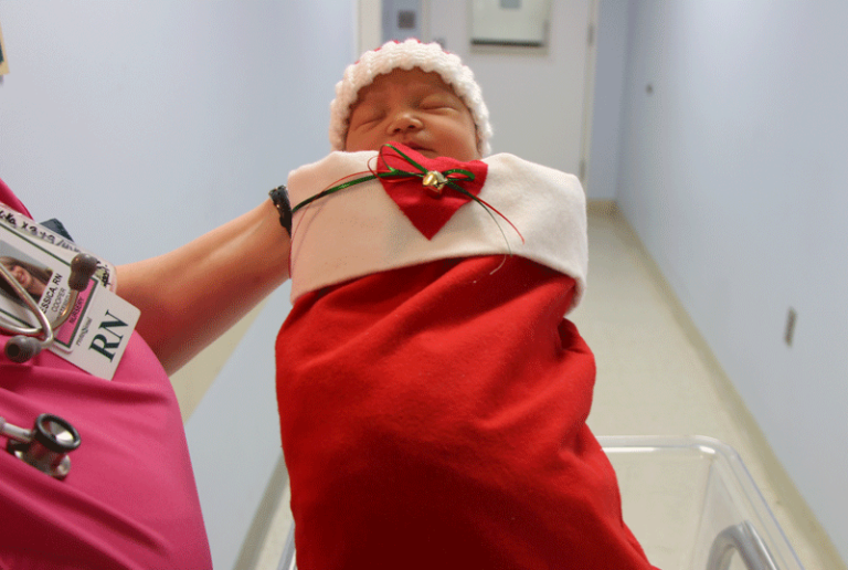 SGMC Volunteer Auxiliary presents stockings to newborns ...